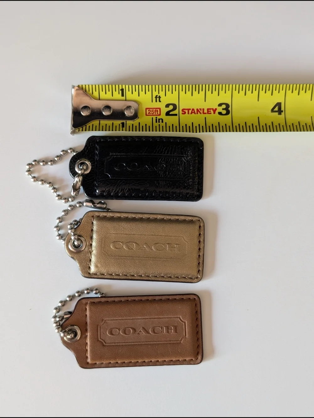 Coach Leather Hangtag Trio - Black, Gold, Brown
